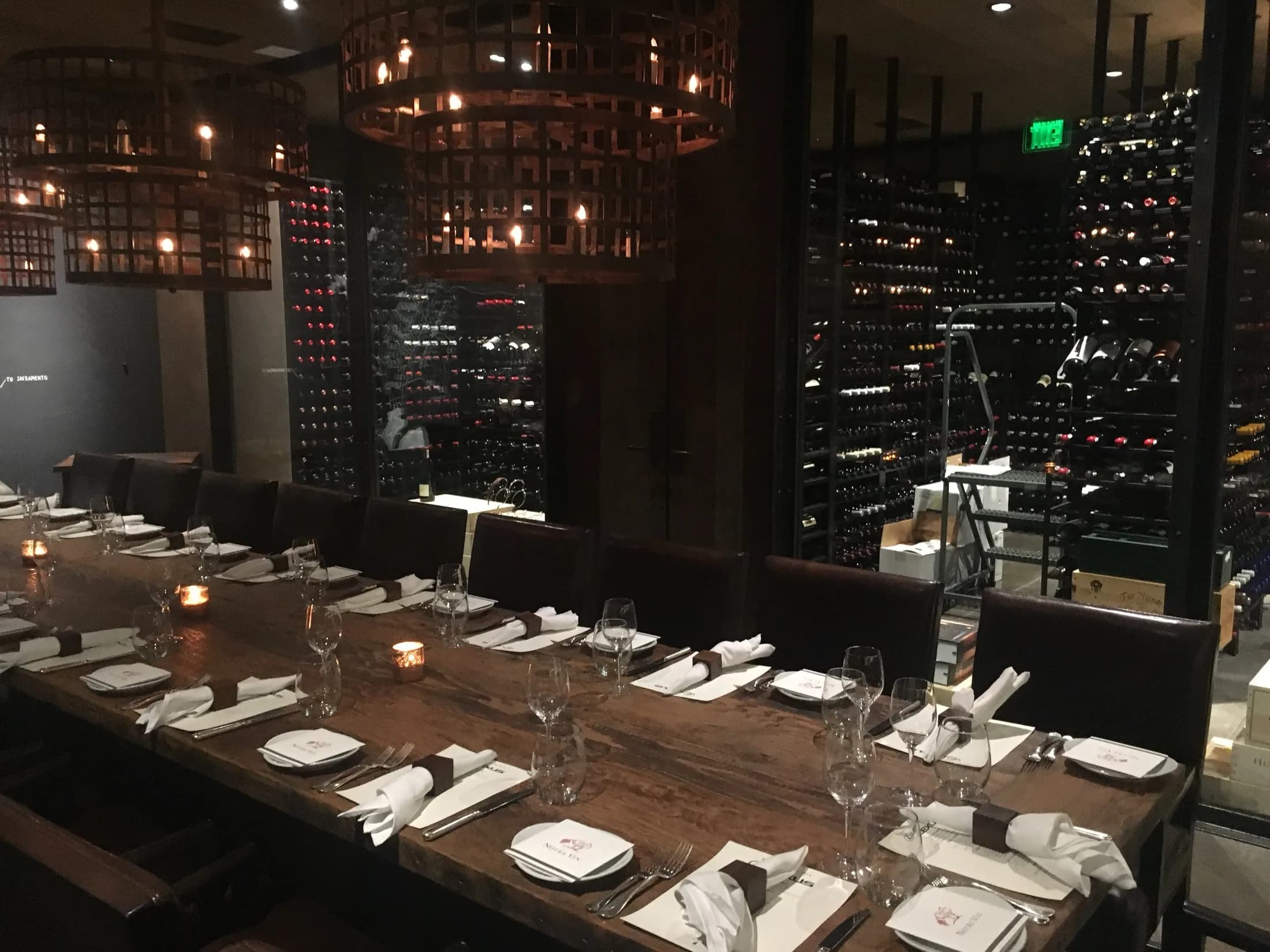 A sommelier pours at an intimate private dinner.